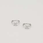 Rhodium-plated sterling silver hoop earrings with four-petal cubic zirconia flower details