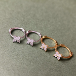 Rhodium-plated and Gold-plated sterling silver hoop earrings with four-petal cubic zirconia flower details
