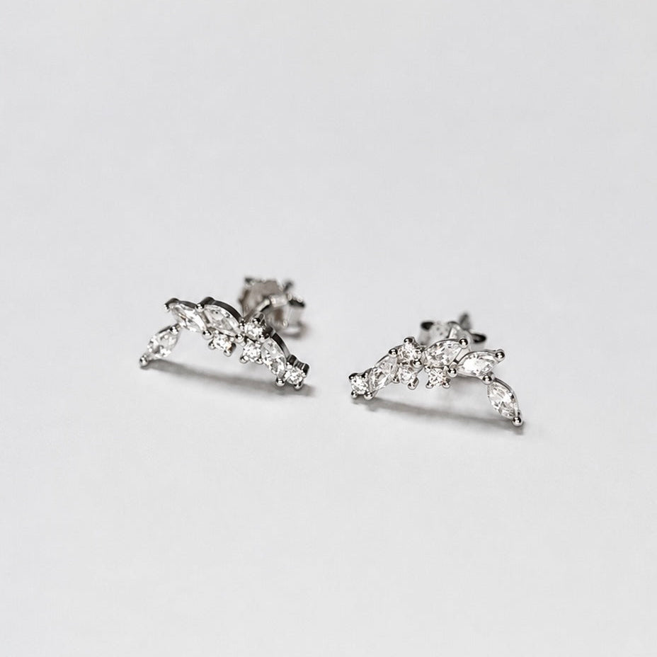 Rhodium-plated sterling silver stud earrings with marquise and round cubic zirconia leaf details