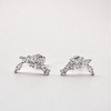 Rhodium-plated sterling silver stud earrings with marquise and round cubic zirconia leaf details on a light background