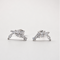 Rhodium-plated sterling silver stud earrings with marquise and round cubic zirconia leaf details on a light background