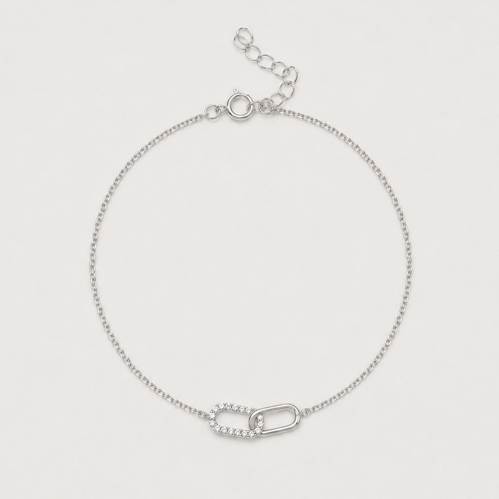Rhodium-plated sterling silver bracelet with interlocking link detail and cubic zirconia stones