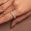Rhodium-plated sterling silver band ring with marquise and round cubic zirconia stones worn on the finger