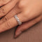 Rhodium-plated sterling silver band ring with marquise and round cubic zirconia stones worn on the finger