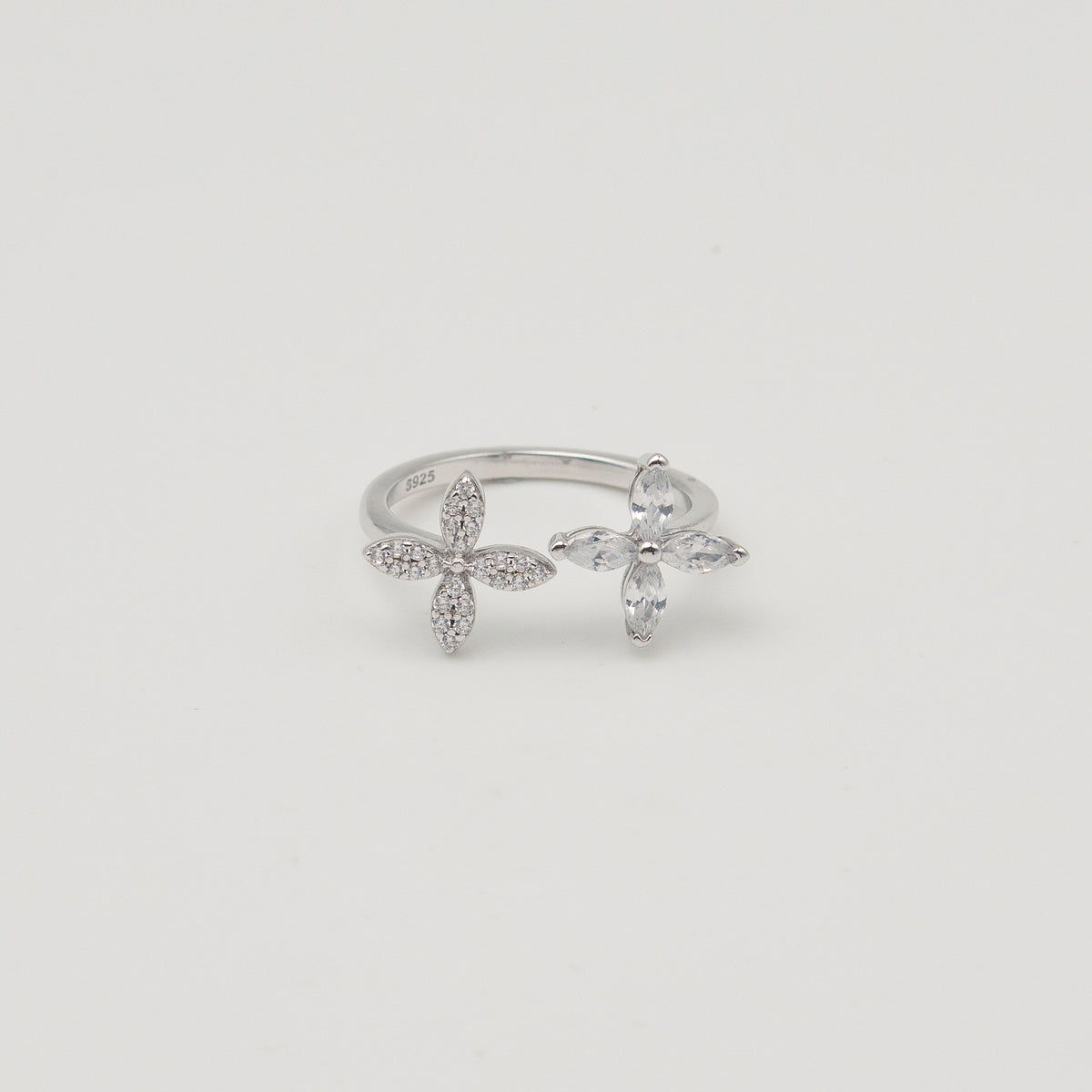 Rhodium-plated sterling silver open ring with marquise-cut clear stones arranged in floral motifs