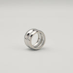 Polished silver stainless steel chunky dome ring on a white background