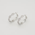 Silver stainless steel hoop earrings with pavé cubic zirconia oval link details 