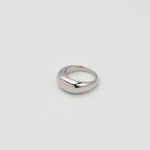 Polished silver stainless steel rounded band ring with a smooth dome profile on a light background