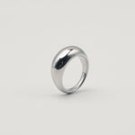 Polished silver stainless steel rounded band ring with a smooth dome profile worn on finger