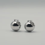 Silver stainless steel sphere drop earrings with a polished finish