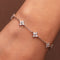 ONIRIQUE sterling silver floral bracelet with cubic zirconia stones worn on the wrist.