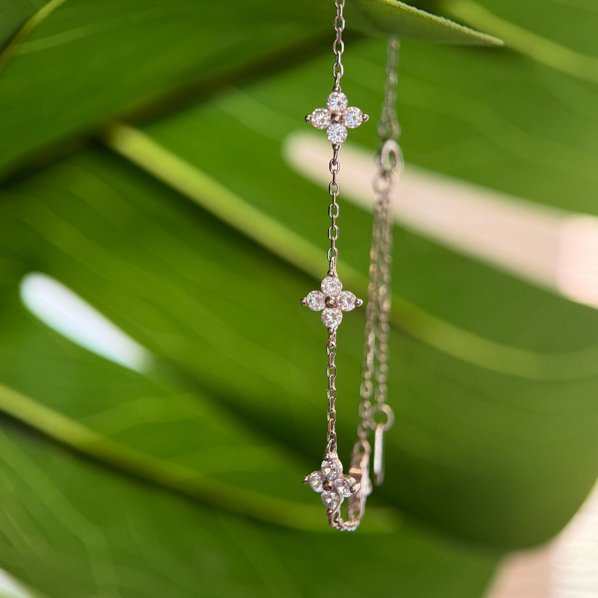 Sterling silver floral bracelet with clear cubic zirconia stones