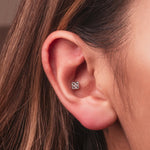 Sterling silver flower round-back ear stud with clear cubic zirconia stones worn on conch
