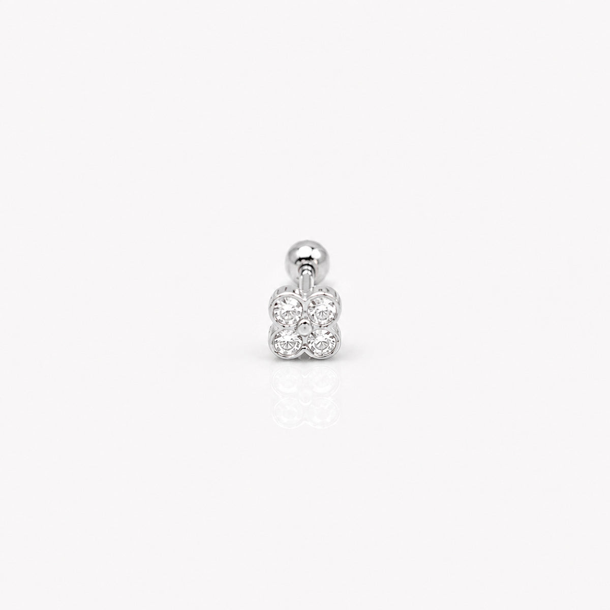 Sterling silver flower round-back ear stud with clear cubic zirconia stones on a white background