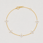 Gold-plated sterling silver flower bracelet with clear cubic zirconia stones.