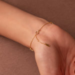 Gold-plated sterling silver flower bracelet with clear cubic zirconia stones.